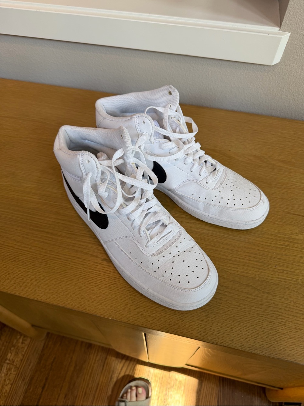 Nike White High-Top Sneakers with Black Swoosh